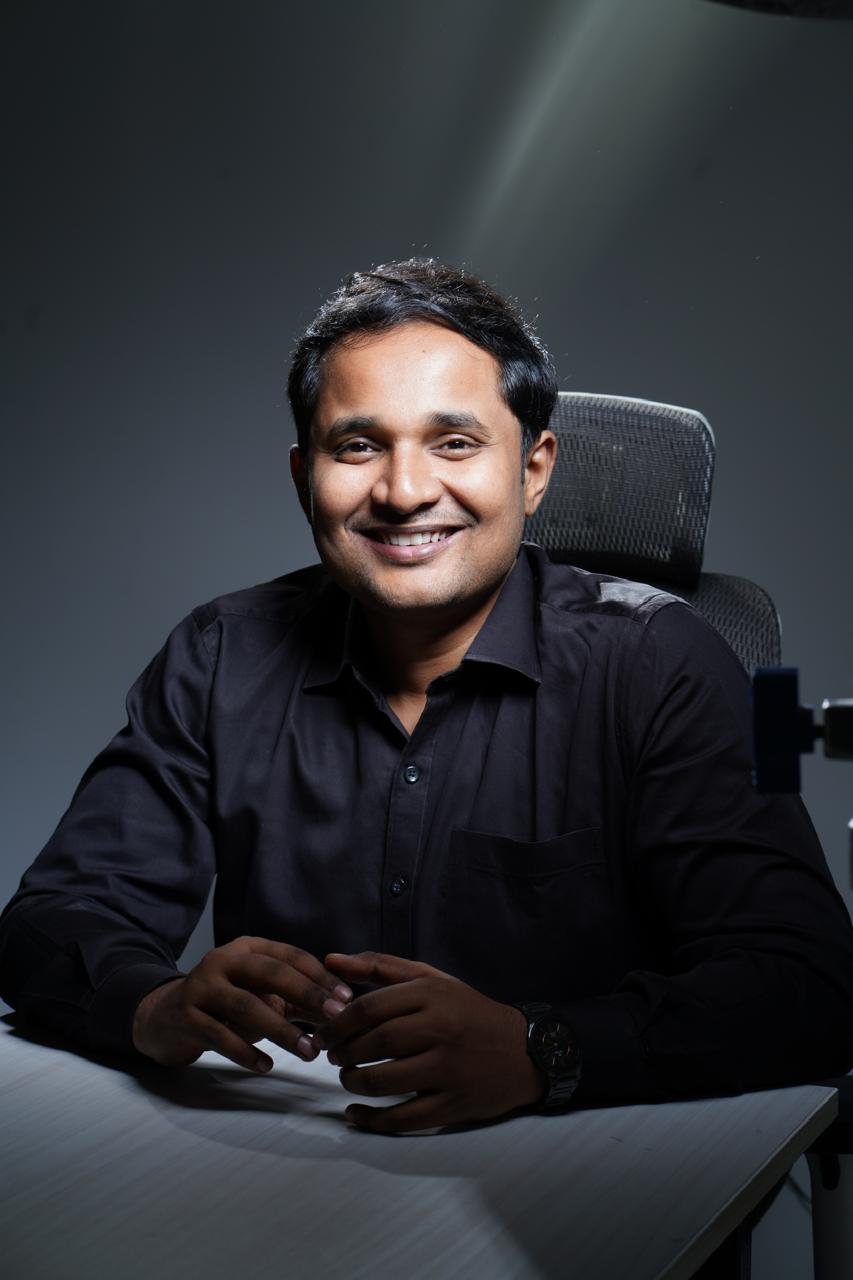 Yeswanth Yarlagadda, musculoskeletal physiotherapist, seated and smiling